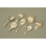 A Victorian cast silver scallop form caddy spoon by Holland, Son & Slater London 1881,