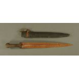 An eastern short sword the blade, with deep blood channel and wooden hilt,