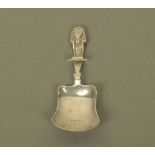 A Victorian silver caddy spoon by Hilliard & Thomason, with Pharoah terminal and plain bowl,