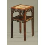 A Chinese hardwood rouge marble topped jardiniere stand with shelf.