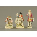 Three continental porcelain figurines, one with beehive mark. Tallest 15.5 cm.