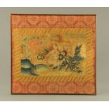 A small 18th century tapestry of flowers, within geometric border and mahogany frame, 62 cm x 65 cm.