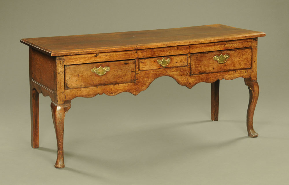 An 18th century oak side table,