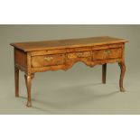 An 18th century oak side table,