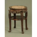 A 19th century Chinese hardwood rouge marble topped jardiniere stand,