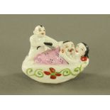 A rare Chinese porcelain erotic group, depicting two lovers interrupted by a man pulling a pigtail,