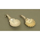 Two George III silver caddy spoons, with scrolled terminals,