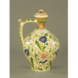 An early 20th century Hungarian pottery puzzle jug, of Zsolnay Pecs design,