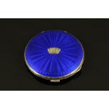 An Art Deco silver and blue enamel RN powder compact, engine turned. Diameter 7.5 cm.