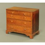 A George III oak chest of drawers,