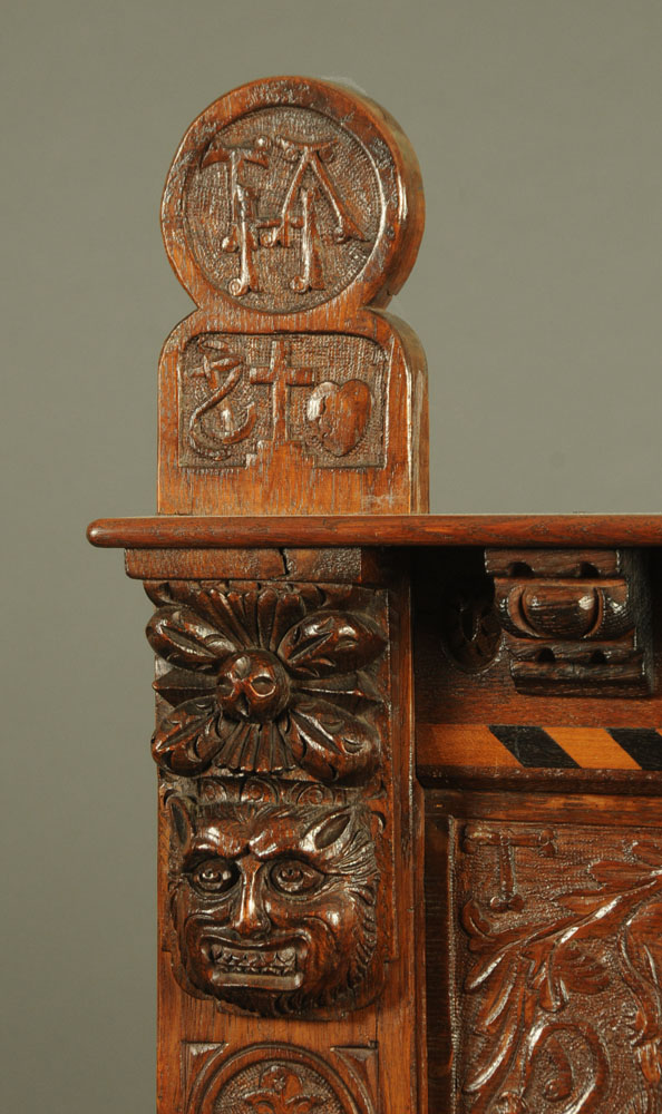 A Victorian carved oak settle, decorated with floral, armorial and religious panels, - Image 10 of 15