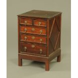 A narrow oak chest of drawers of 19th century design,