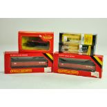 Hornby 00 Gauge Model Railway issues comprising trio of wagons plus trackside signal duo.