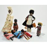 An interesting group of Vintage Ethnic Dolls, Wood and Felt covered Maid, carrying a mop and bucket,