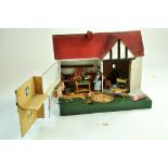 An elegantly presented themed Butcher's dolls house comprising wooden cottage and items pertaining