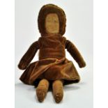 An Antique 16” Handmade Cloth Doll, cotton face with painted features no longer visible, in a