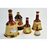 A group of Wade Whisky Decanters, Bells. Decanters are empty.