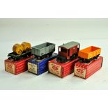 Hornby Dublo 00 Gauge model railway issues comprising wagons No. 4646, 32057, 4311 and 4660. Look to