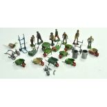 A group of lead metal figures comprising wheelbarrows, lawn mowers and other items. Britains and