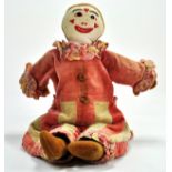 A Vintage 17” Rag Doll Clown. A White cotton face with sewn features and a soft body, lower hand and