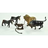 An interesting group of metal animal figures inclusive of trio of donkeys, a gold lion on chain plus