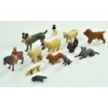 A small group of interesting metal dog (and other animal) figures including a cold painted bronze