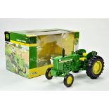 Ertl Collector Edition 1/16 John Deere 1010 Tractor. Has been on display, otherwise appears