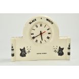 A Black and White Scotch Whisky Clock. In good working order.
