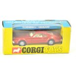 Corgi No. 276 Oldsmobile Toronado with 'take off wheels' and 'golden jacks'. Metallic red body,