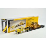 Norscot 1/50 diecast truck issue comprising CAT themed Peterbilt 389 with Lowboy and Crawler Load.