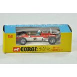 Corgi No. 158 Lotus Climax Racing Car. Orange and white body with a white base. Blue driver with a