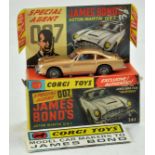 Corgi No. 261 James Bond 007 Aston Martin DB5. Gold Body with red interior, with figures. Complete