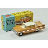 Corgi No. 248 Chevrolet Impala with tan body, light cream roof, cream interior and chrome hubs.