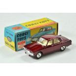 Corgi No. 252 Rover 2000. Metallic maroon body with yellow interior. Spun hubs. Appears excellent