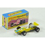 Matchbox Superfast No. 34D F-1 Racing Car. Yellow body, unpainted base, clear glass and blue