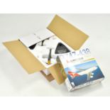 Duo of diecast model aircraft with boxes.