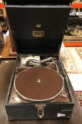 A vintage HMV portable or tabletop gramophone in black leatherette style case