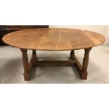 A modern oak circular dining table, approx 184 cm diameter,