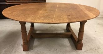 A modern oak circular dining table, approx 184 cm diameter,