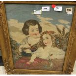 A Victorian needlework panel depicting two young girls with flowers,