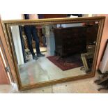 A modern gilt framed rectangular wall mirror with bevel edge plate,