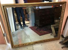 A modern gilt framed rectangular wall mirror with bevel edge plate,