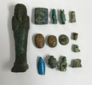 An Egyptian turquoise glazed ushabti figure, 8 cm L,