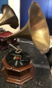 An HMV table top gramophone with embossed horn on an octagonal oak base,