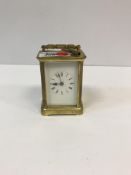 A circa 1900 lacquered brass cased carriage timepiece, approx 14.