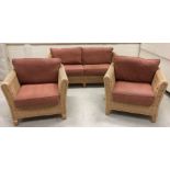 A modern canework convservatory suite comprising two seat sofa,