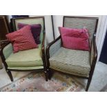 A set of three modern armchairs with stained show frames and coordinating upholstery,