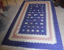 A pair of blue ground Kelim rugs, with pink and cream borders,