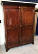 A circa 1900 mahogany two-door wardrobe,