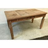 A modern pine dining table and six pine panel seated chairs,